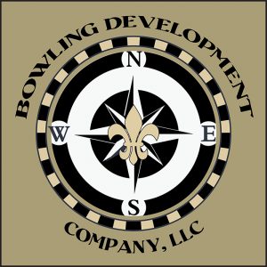 Bowling Development Company Logo with compass and fleur de lys on a khaki background